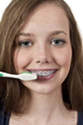 Beautiful Teenage Woman Brushing Teeth