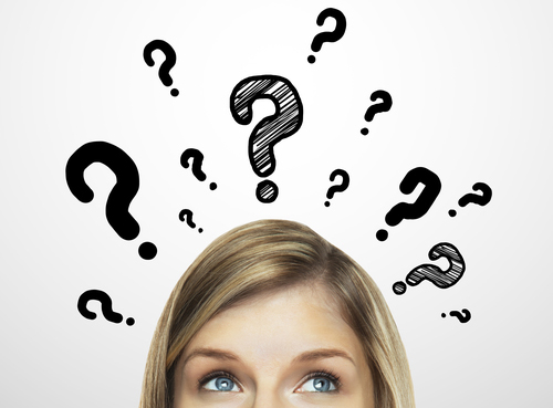 woman thinking about braces and her appearance with question marks above head
