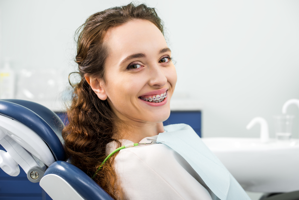 woman with braces at the orthodontist office
