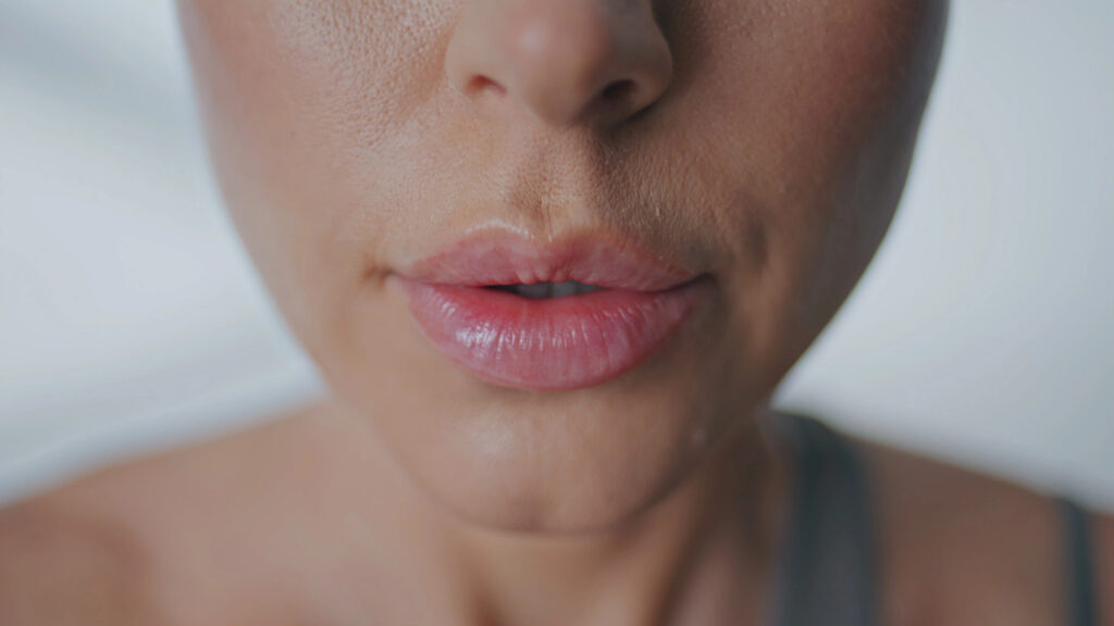 Close up of woman mouth breathing