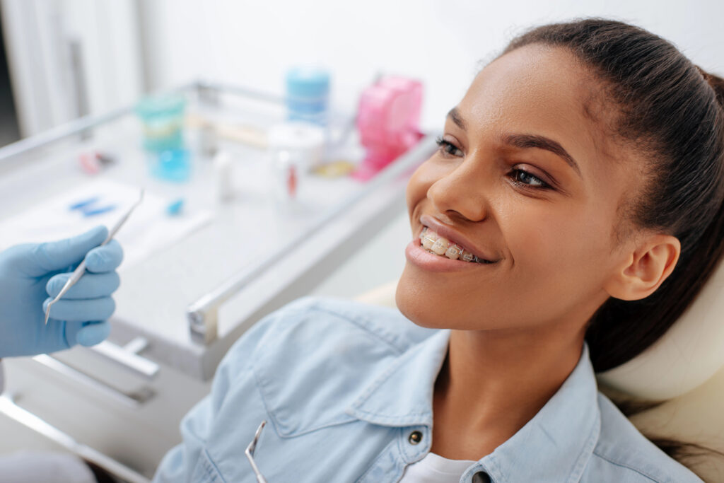 Young woman getting braces.